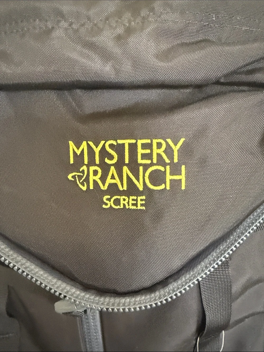 MYSTERY RANCH Scree Backpack in Black with Yellow Accent